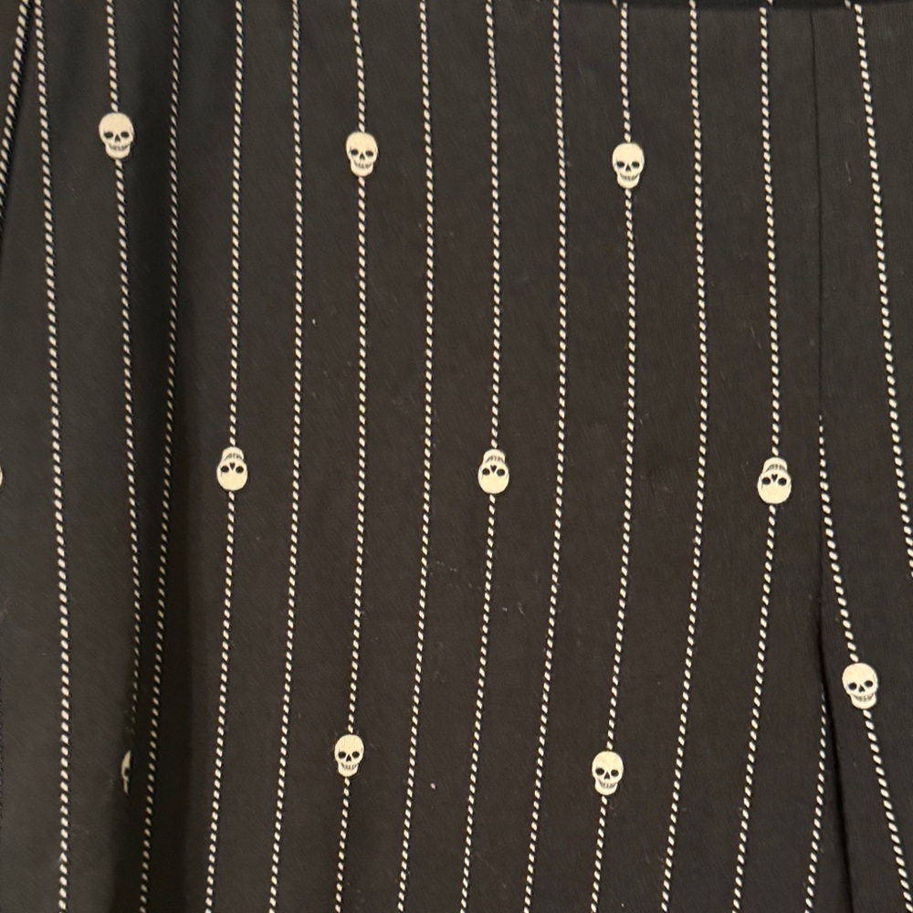 Torrid Black Pinstripe leggings with Skull Accents
